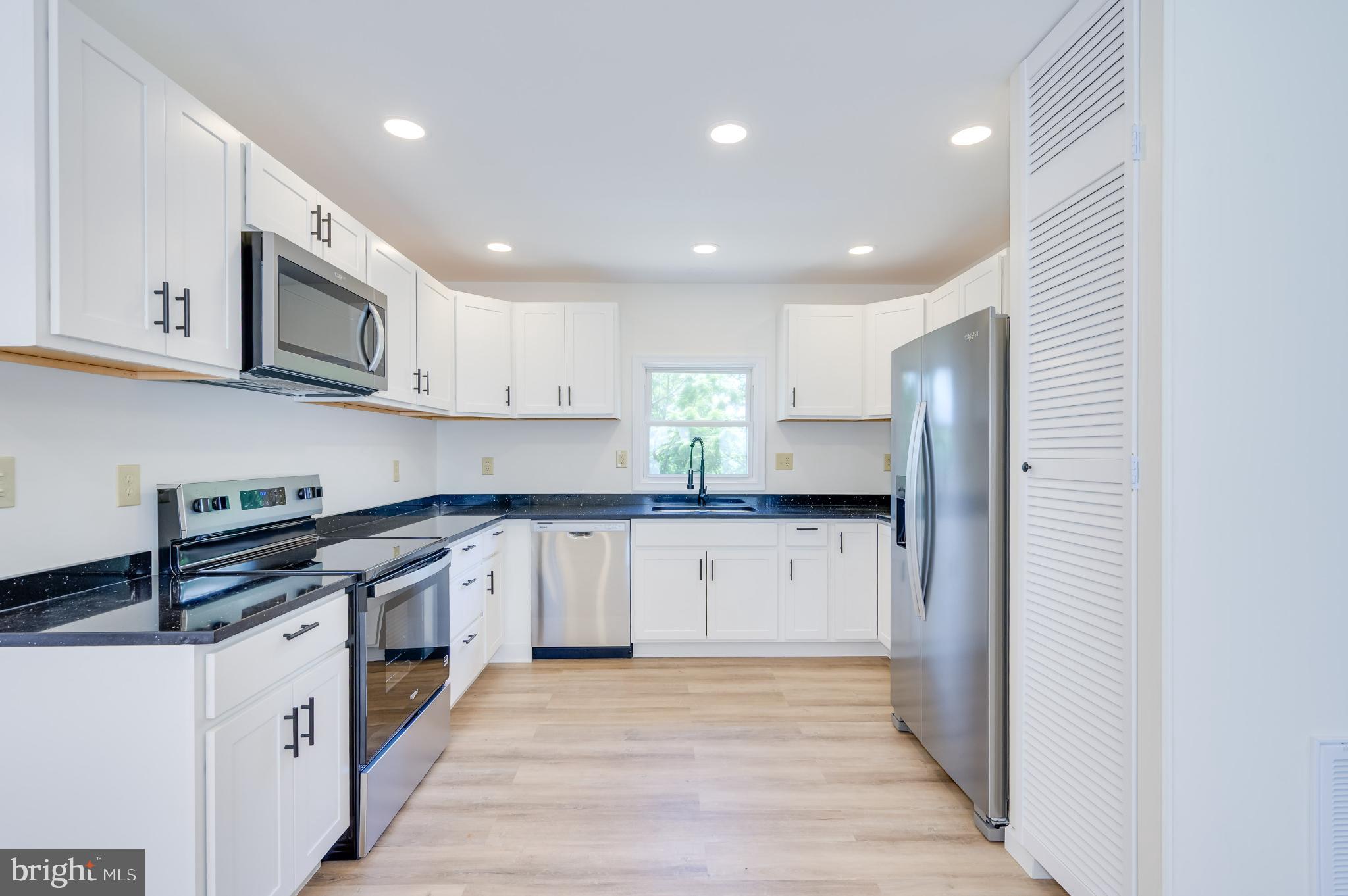 2968 Sulphur Springs Road Inwood, WV 25428 - Photo 49 of 65 Modern kitchen with sleek finishes.