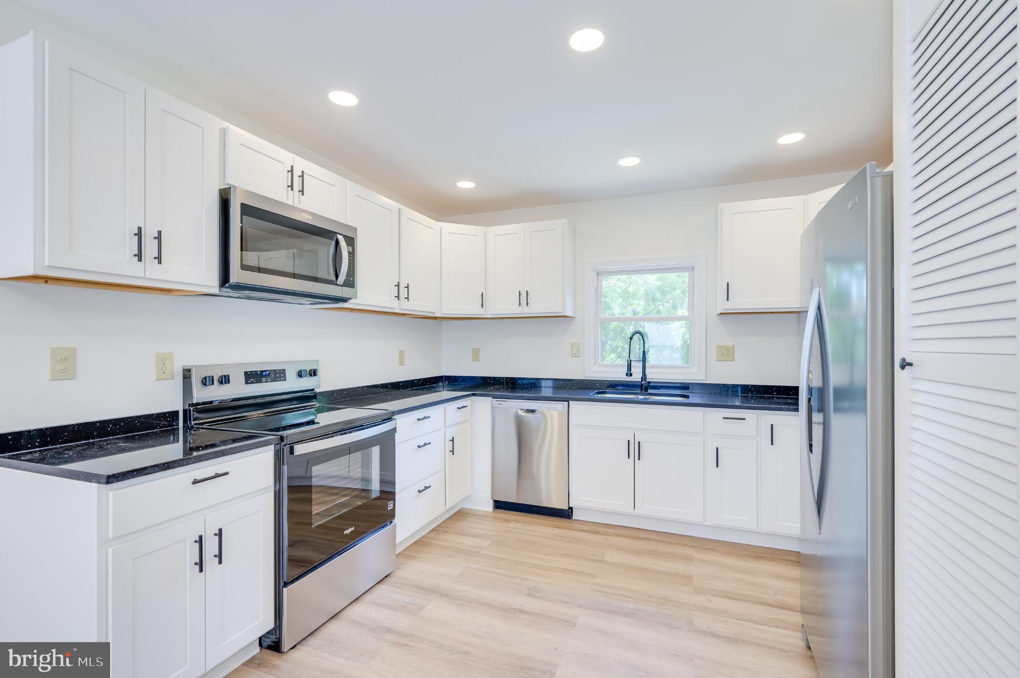 2968 Sulphur Springs Road Inwood, WV 25428 - Photo 50 of 65 Modern kitchen with sleek finishes.