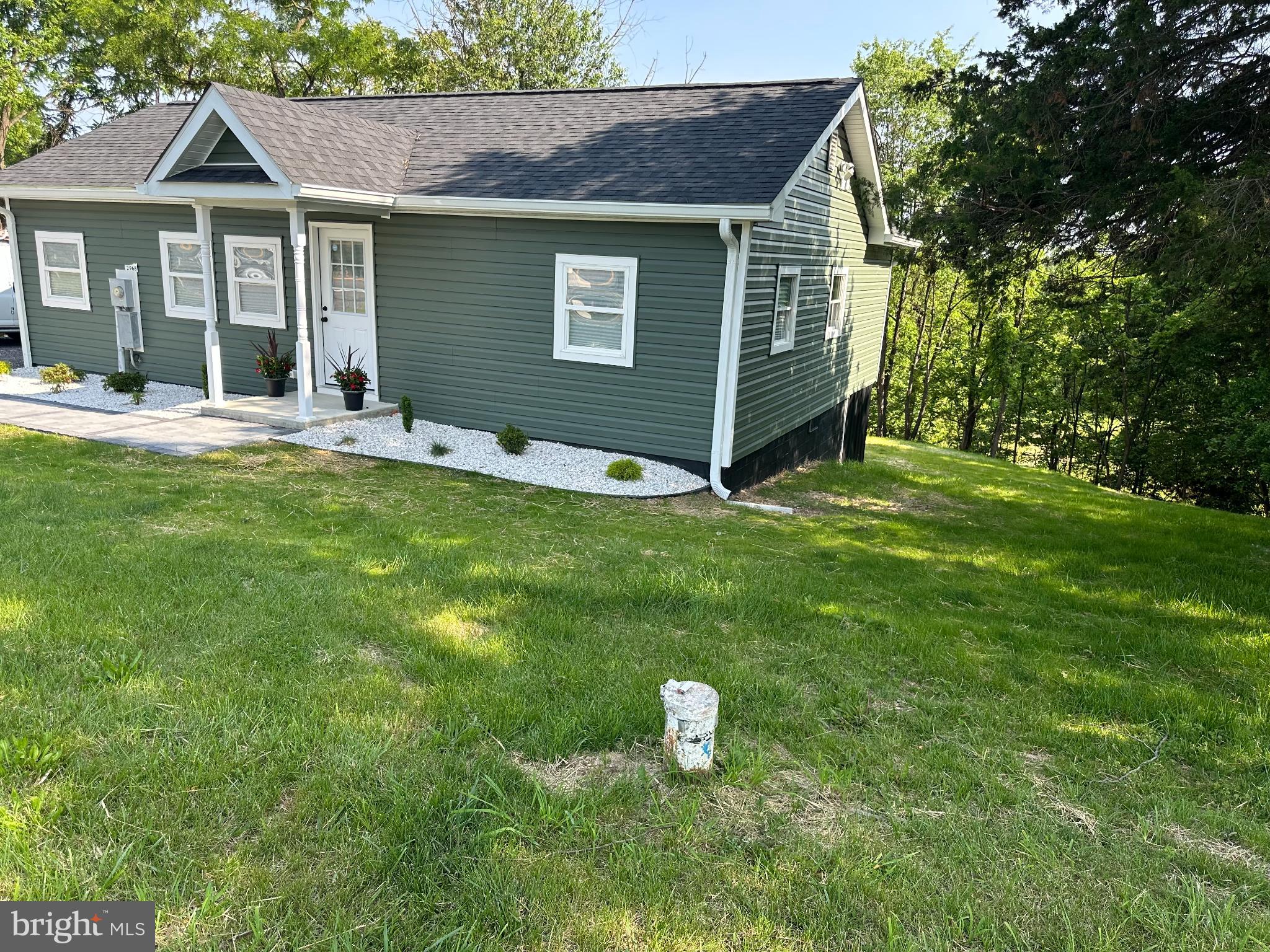 2968 Sulphur Springs Road Inwood, WV 25428 - Photo 63 of 65 Charming green home nestled in lush greenery.