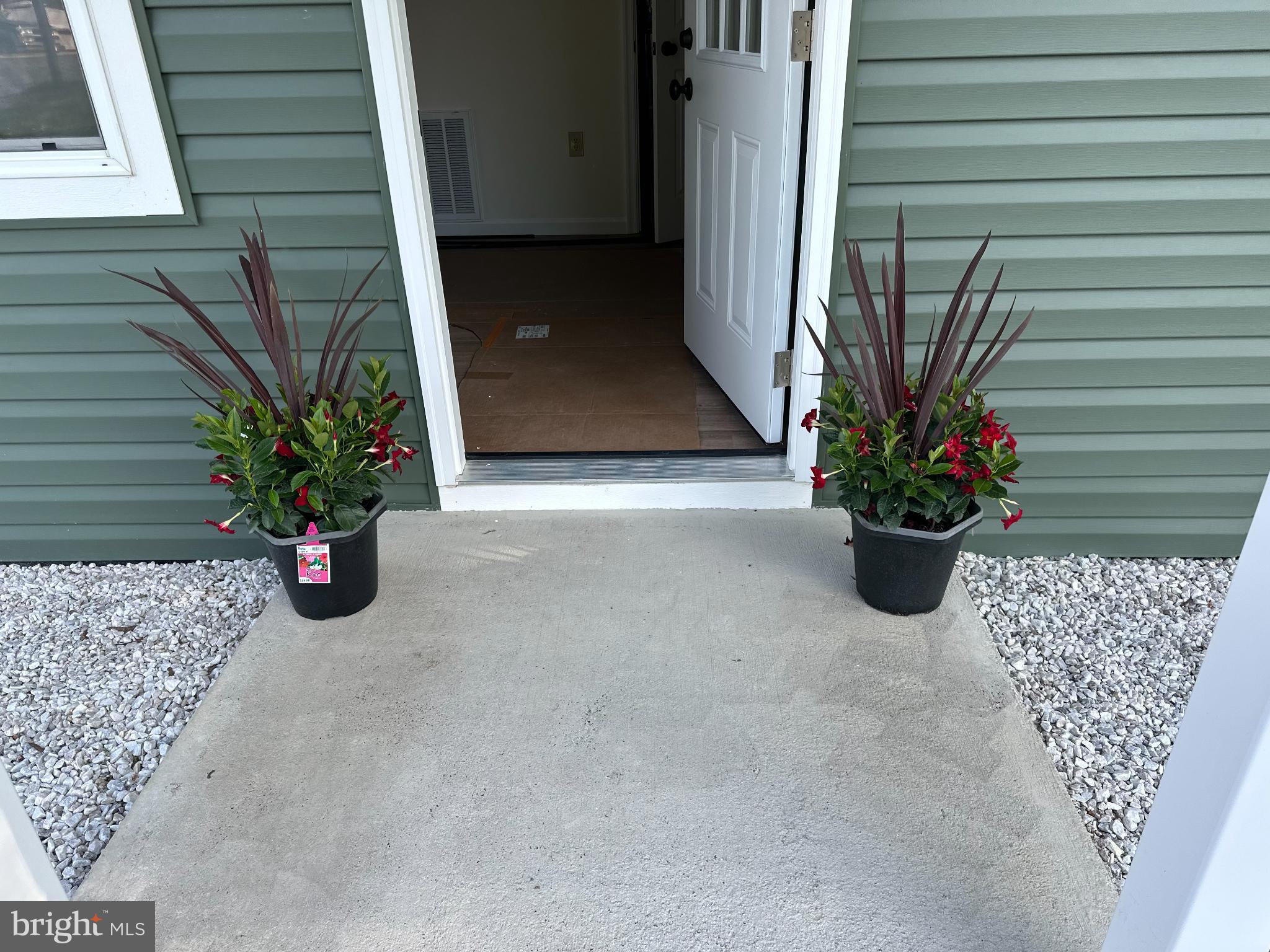 2968 Sulphur Springs Road Inwood, WV 25428 - Photo 65 of 65 Welcoming entrance with vibrant planters.