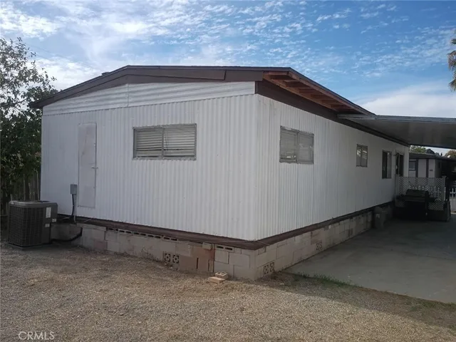 a view of a yard with cars parked