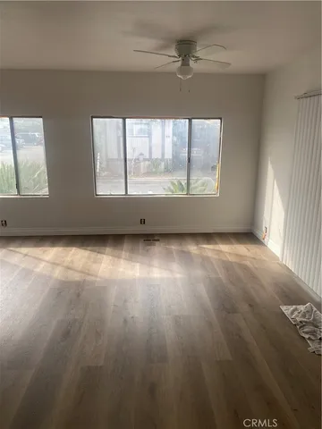 a view of an empty room with windows