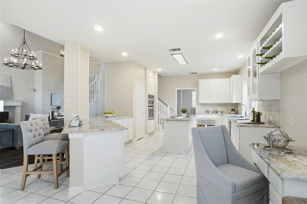 132 Rustic Meadow Way Coppell, TX 75019 - Photo 14 of 39 a living room with furniture a dining table and chairs