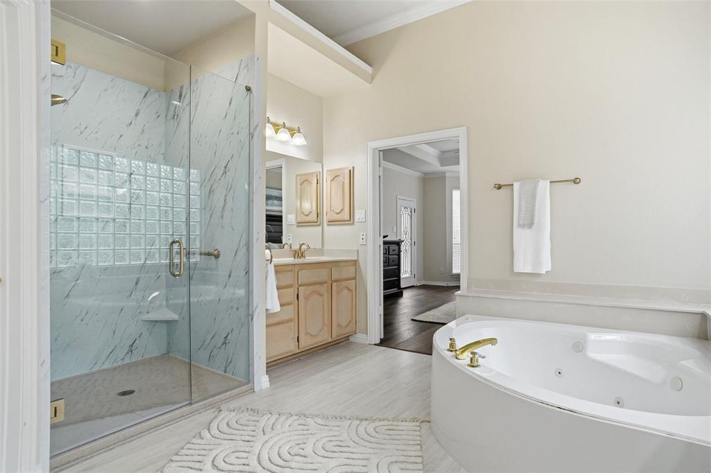132 Rustic Meadow Way Coppell, TX 75019 - Photo 19 of 39 a bathroom with a bathtub shower sink and toilet
