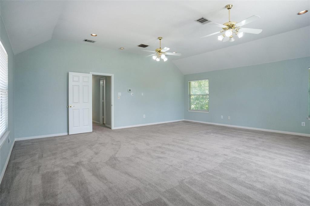 132 Rustic Meadow Way Coppell, TX 75019 - Photo 30 of 39 a view of empty room with a ceiling fan and window