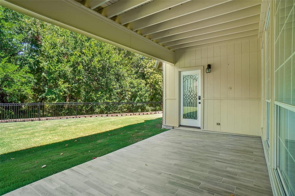 132 Rustic Meadow Way Coppell, TX 75019 - Photo 34 of 39 a view of a room with wooden floor and a yard