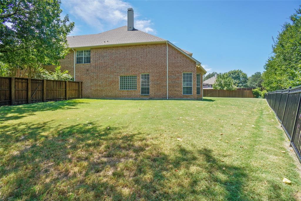 132 Rustic Meadow Way Coppell, TX 75019 - Photo 36 of 39 a front view of house with yard and trees in the background