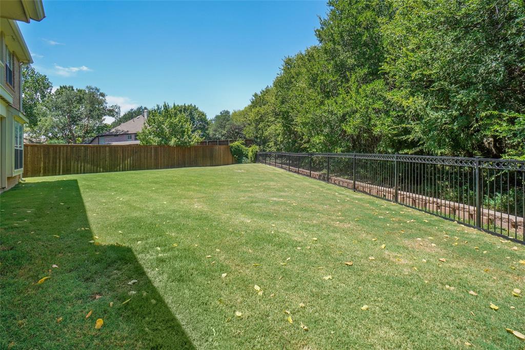 132 Rustic Meadow Way Coppell, TX 75019 - Photo 37 of 39 a view of a lake with a yard