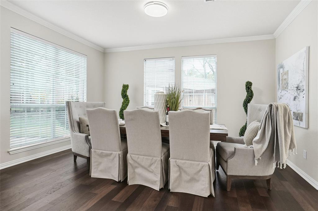 132 Rustic Meadow Way Coppell, TX 75019 - Photo 7 of 39 a view of a dining room with furniture window and wooden floor