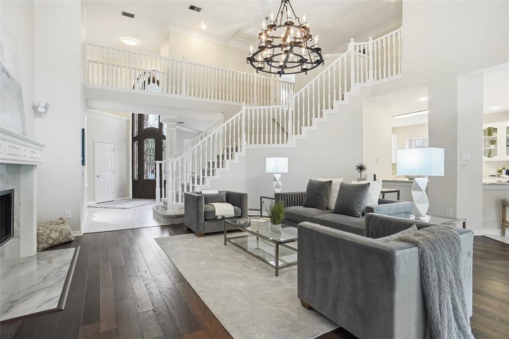 132 Rustic Meadow Way Coppell, TX 75019 - Photo 9 of 39 a living room with furniture and a chandelier