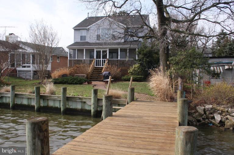 6608 River Drive Road Sparrows Point, MD 21219 - Photo 1 of 16 a view of a house with backyard and sitting area