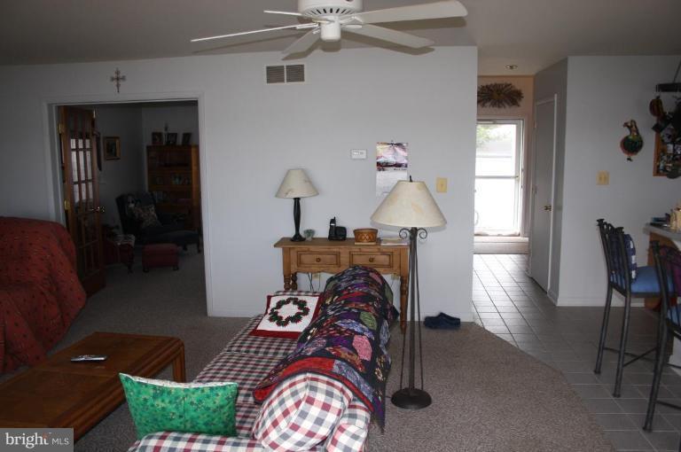 6608 River Drive Road Sparrows Point, MD 21219 - Photo 5 of 16 a living room with furniture and a wooden floor