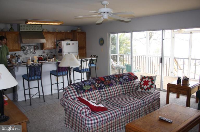 6608 River Drive Road Sparrows Point, MD 21219 - Photo 8 of 16 a living room with furniture and a large window