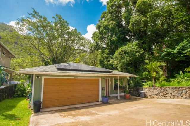 2847 Numana Road Honolulu, HI 96819 - Photo 1 of 1 a front view of a house with a garden
