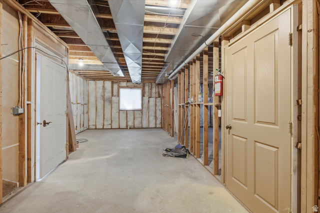 560 East 700 North Logan, UT 84321 - Photo 24 of 32 Unfinished basement featuring exposed wood framing, concrete flooring, ductwork, and a window for natural light