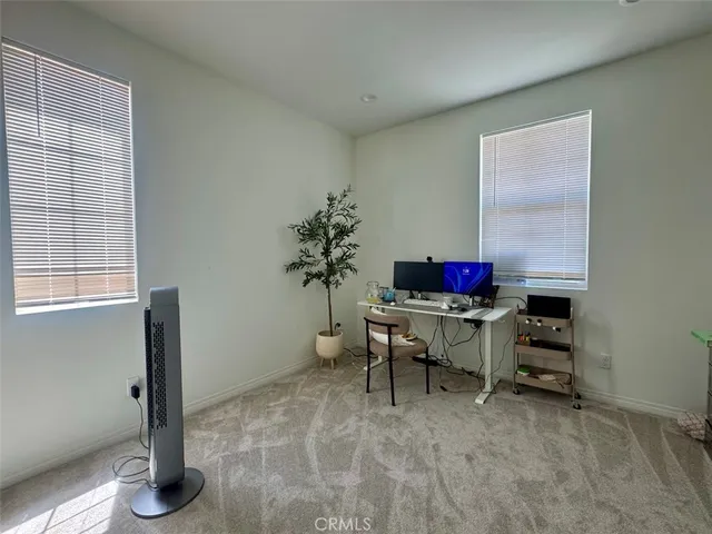 a workspace with furniture and window