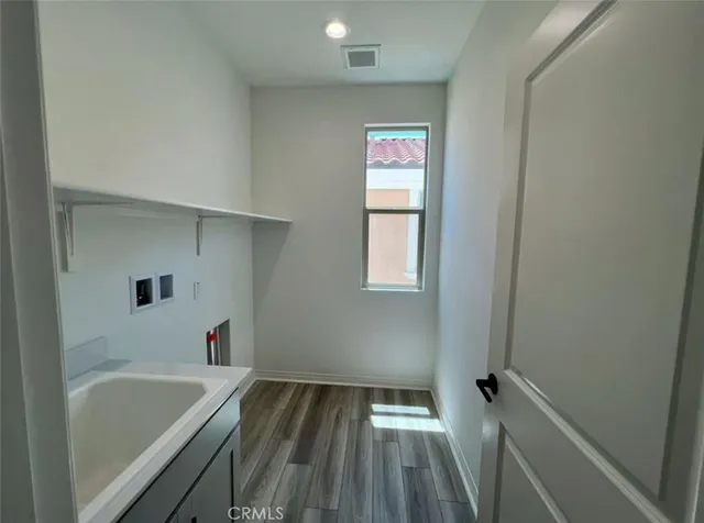 a bathroom with a bathtub and a window