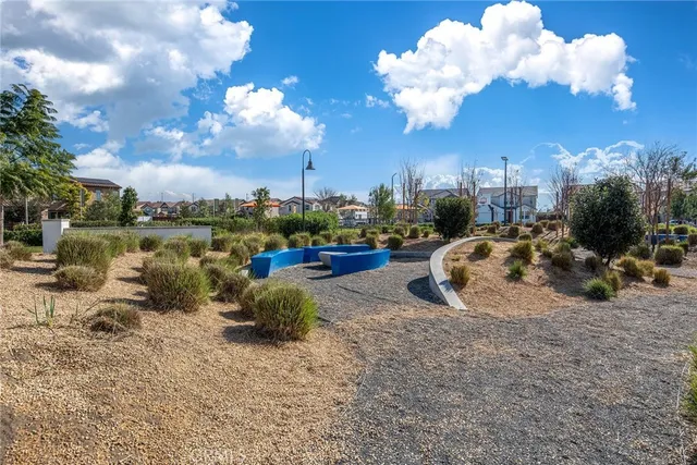 a view of a park with sitting area
