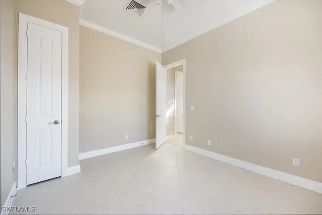 an empty room with a empty space and a ceiling fan