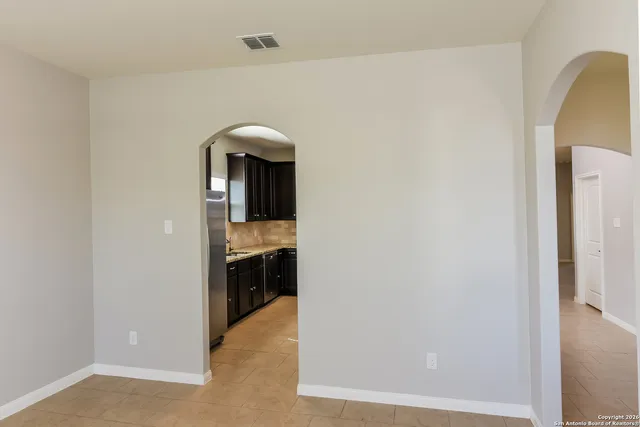 a view of a kitchen from the hallway