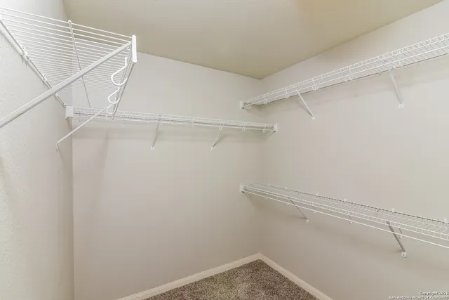a view of an empty walk in closet