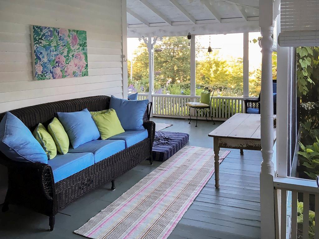 Screened porch wraps around for...