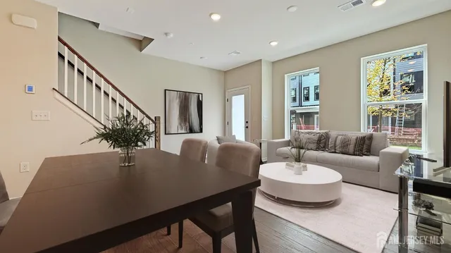 a living room with furniture and a table