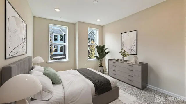 a bedroom with furniture and windows