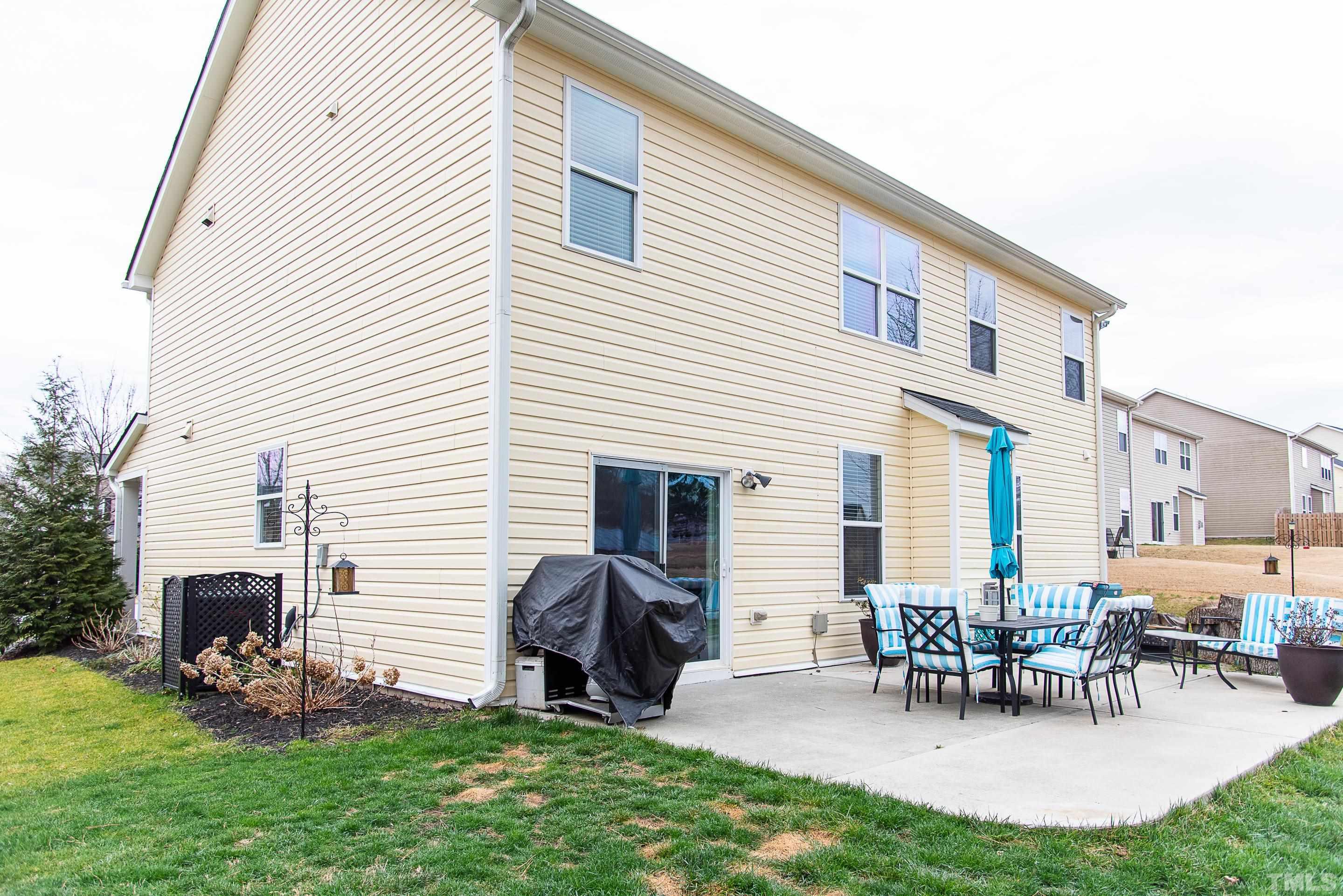 612 Hope Valley Road Knightdale, NC 27545 - Photo 11 of 56 a view of a house with patio and a yard