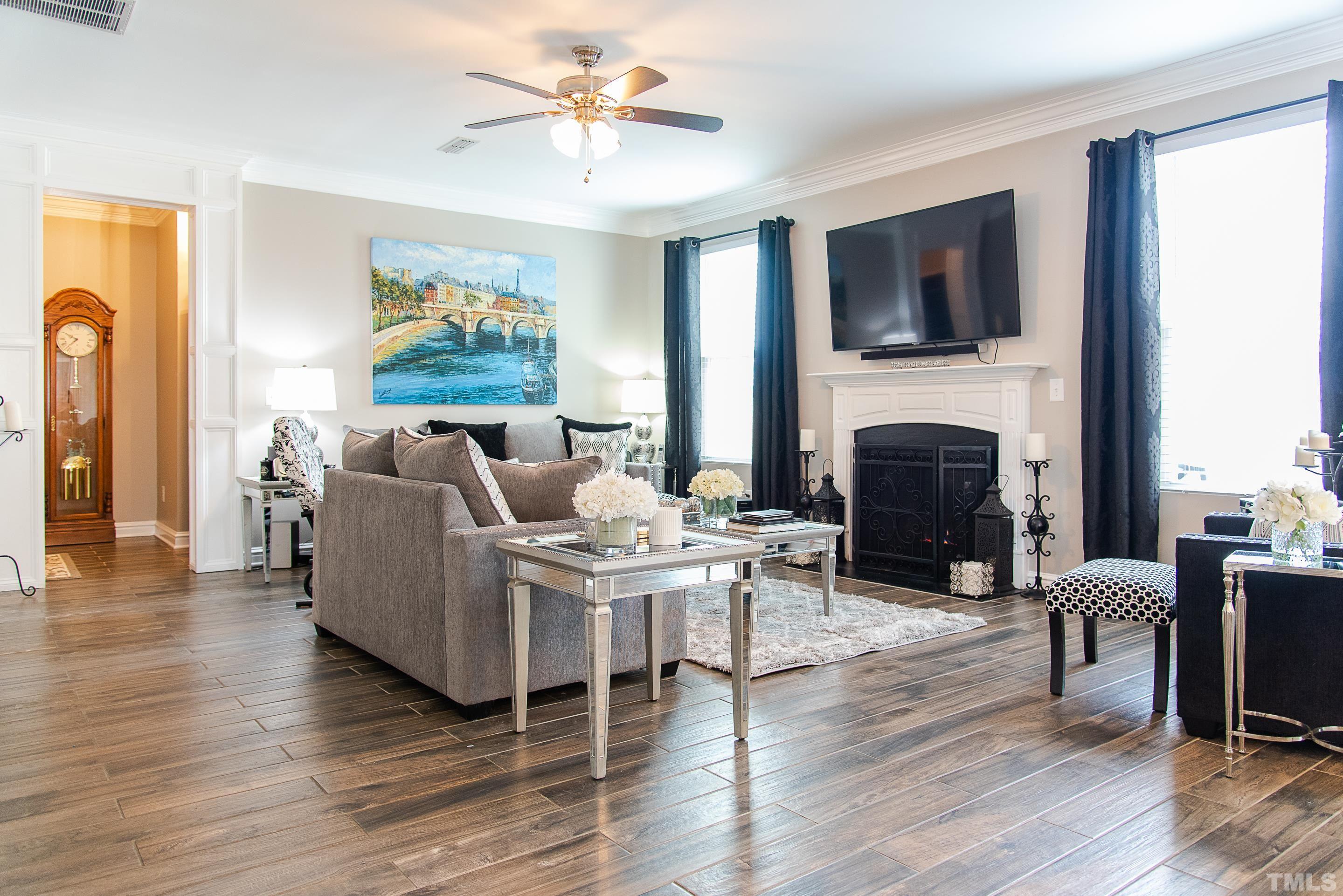 612 Hope Valley Road Knightdale, NC 27545 - Photo 25 of 56 a living room with furniture fireplace and a flat screen tv