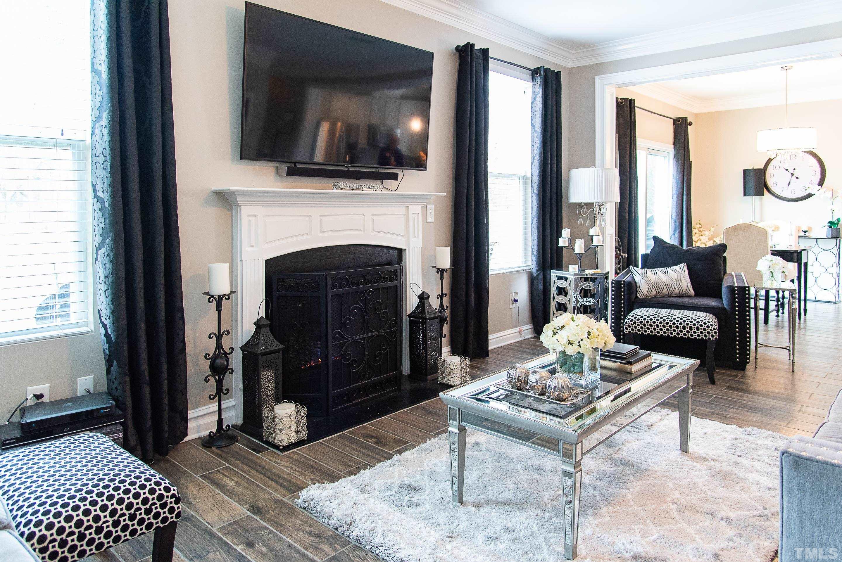 612 Hope Valley Road Knightdale, NC 27545 - Photo 27 of 56 a living room with furniture and a fireplace