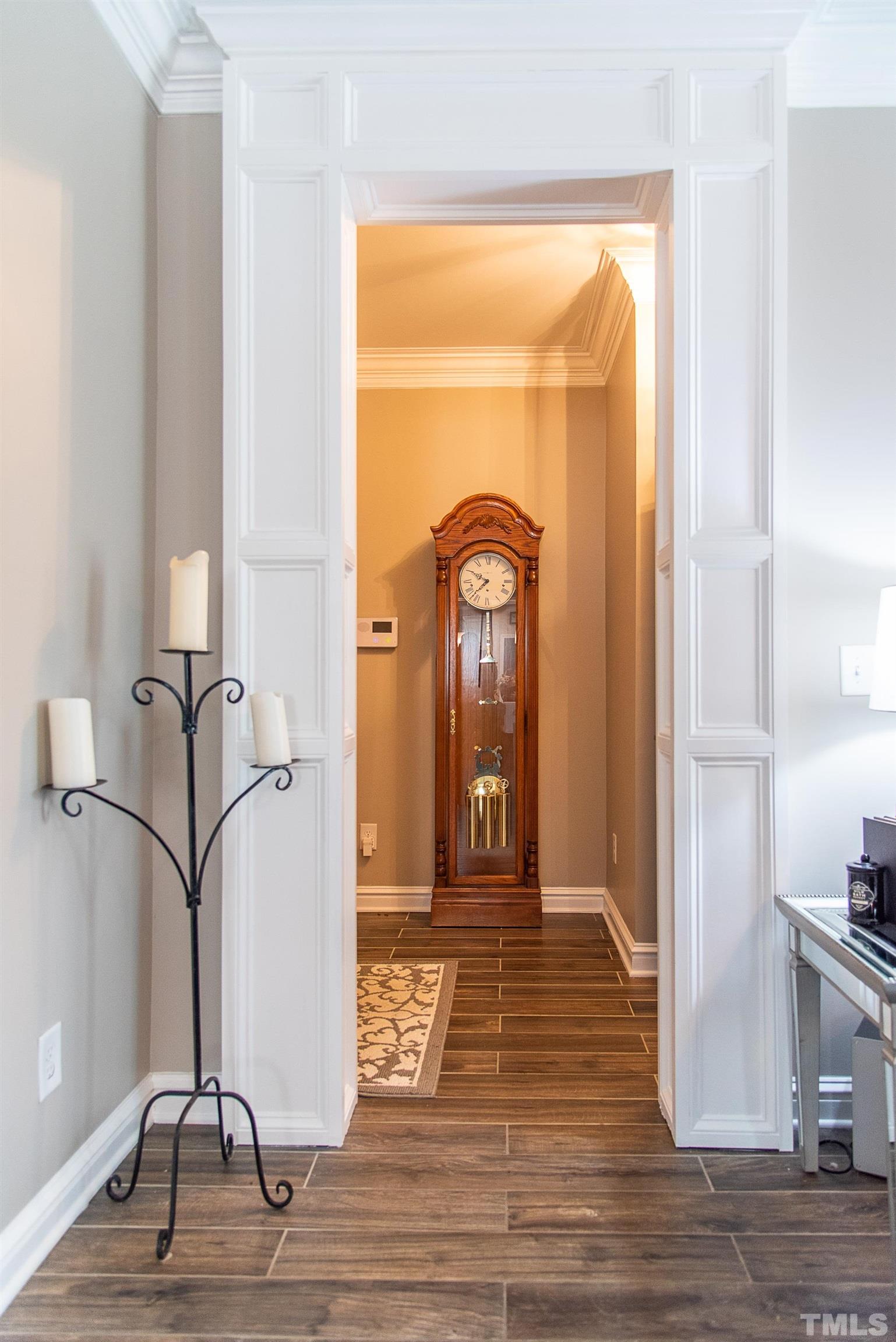 612 Hope Valley Road Knightdale, NC 27545 - Photo 31 of 56 a view of a hallway with wooden floor and dining room