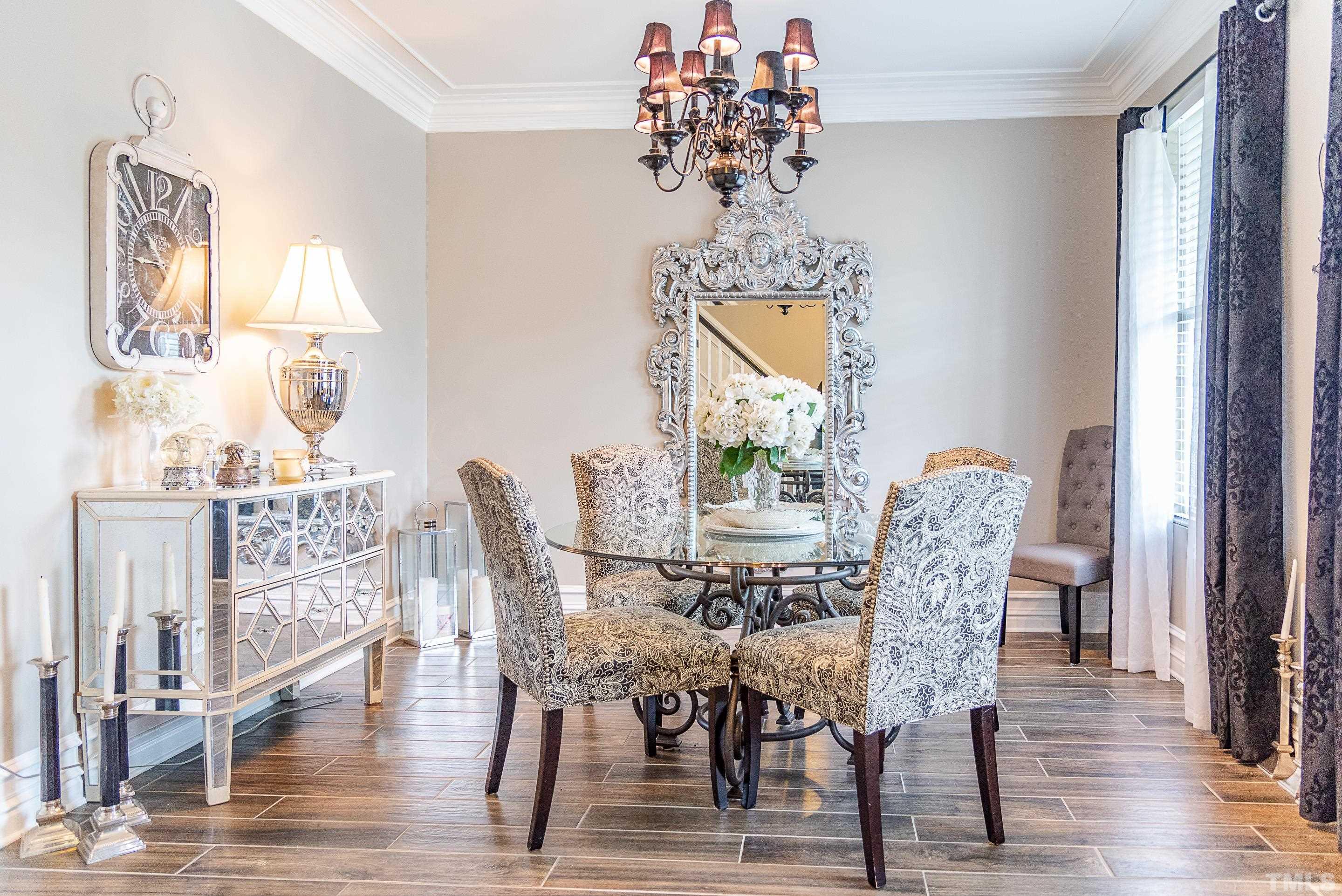 612 Hope Valley Road Knightdale, NC 27545 - Photo 38 of 56 a view of a dining room with furniture wooden floor and chandelier