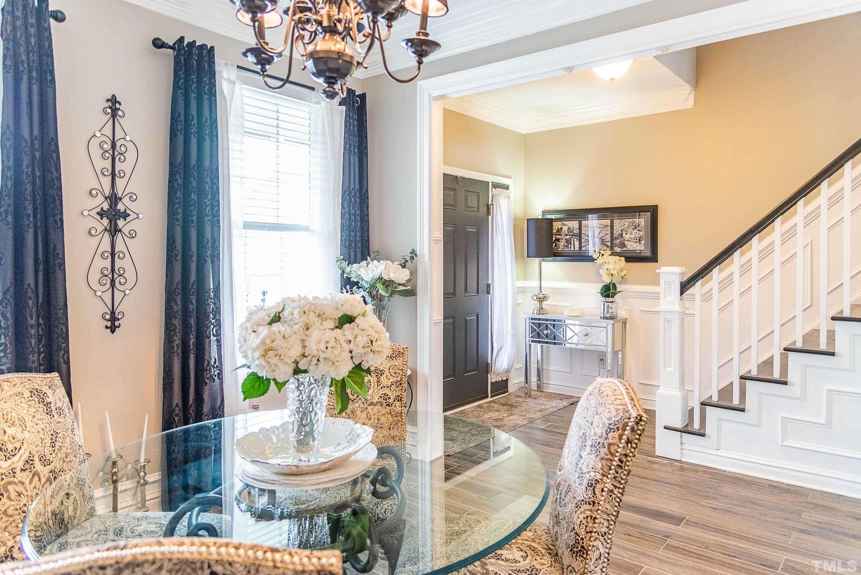 612 Hope Valley Road Knightdale, NC 27545 - Photo 39 of 56 a living room with furniture and a chandelier