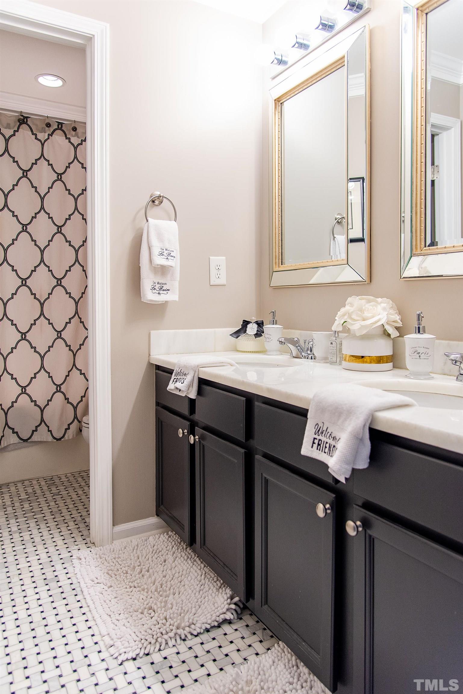 612 Hope Valley Road Knightdale, NC 27545 - Photo 42 of 56 a bathroom with a sink and a mirror