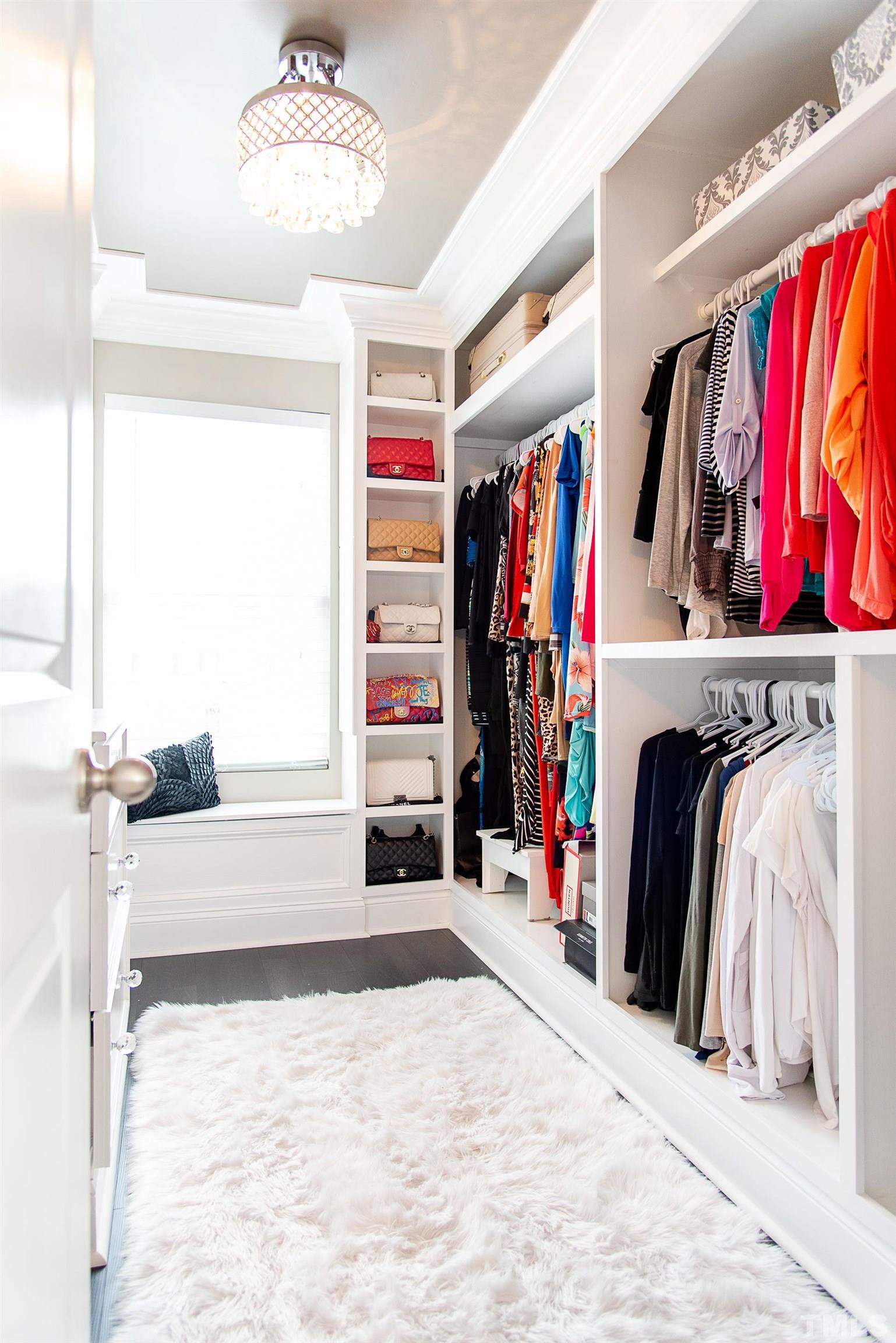 612 Hope Valley Road Knightdale, NC 27545 - Photo 52 of 56 a view of walk in closet with clothes and shoes