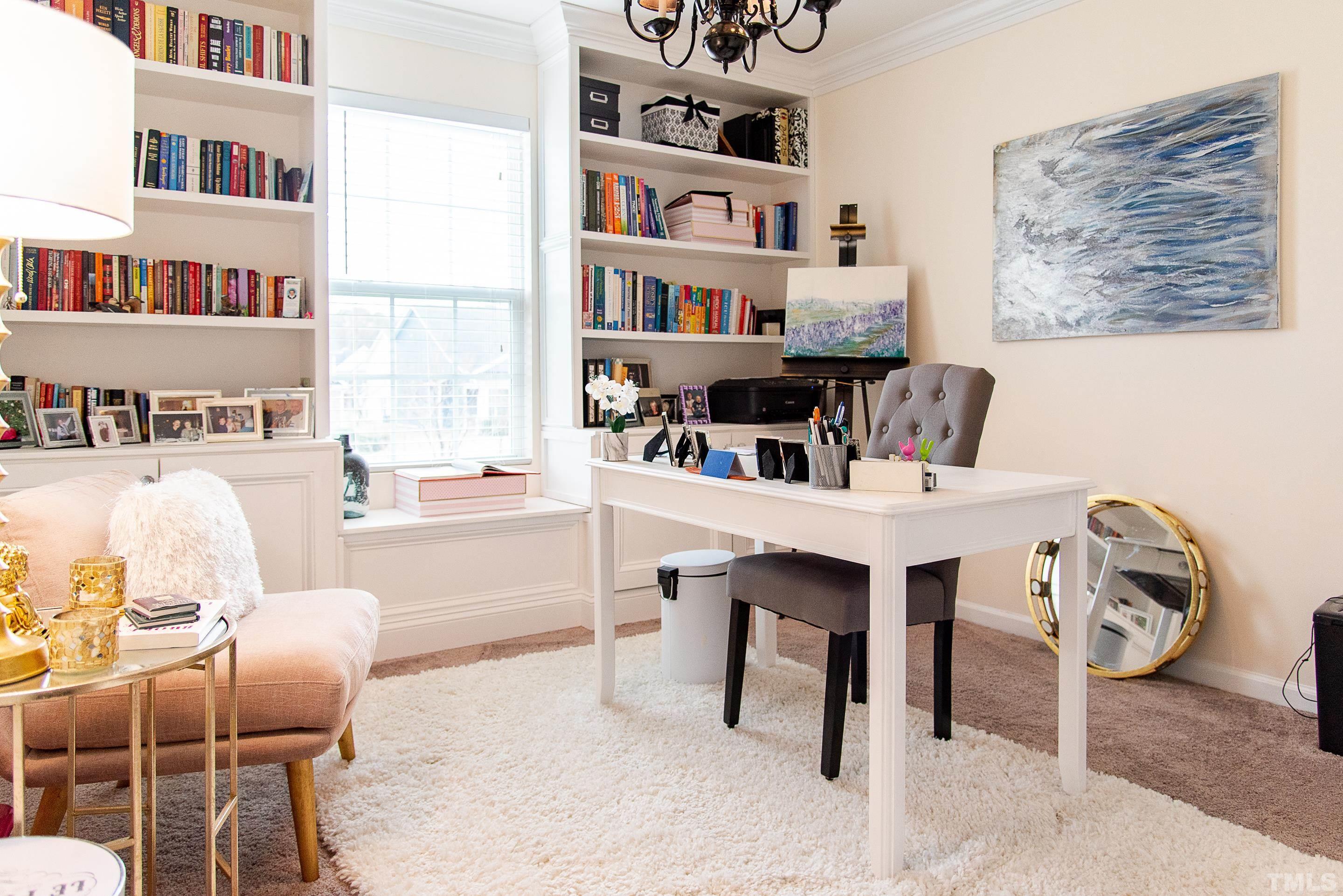 612 Hope Valley Road Knightdale, NC 27545 - Photo 55 of 56 a living room with furniture a rug and a book shelf