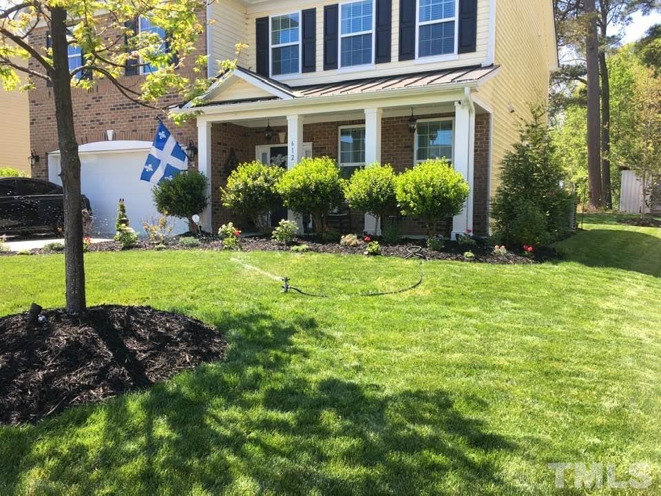 612 Hope Valley Road Knightdale, NC 27545 - Photo 6 of 56 a front view of a house with garden