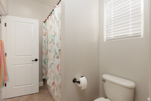 1257 West 2320 South St. George, UT 84770 - Photo 27 of 55 Bathroom featuring a white toilet, window with white blinds, and tiled flooring
