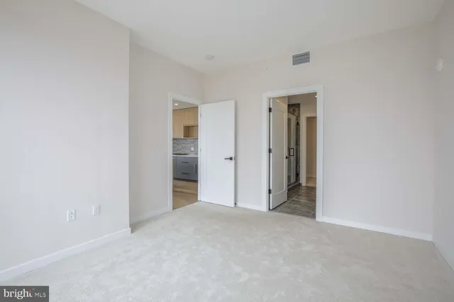 a bathroom with a double vanity sink toilet and shower