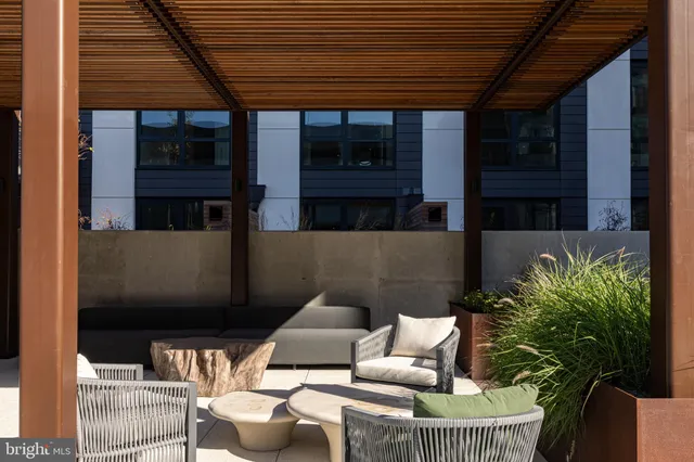 a outdoor living space with furniture and a potted plant