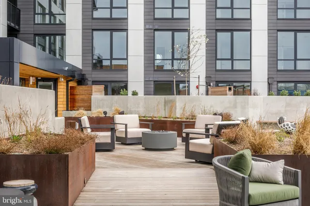 a view of a patio filled with furniture