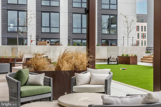 a outdoor living space with furniture and garden view