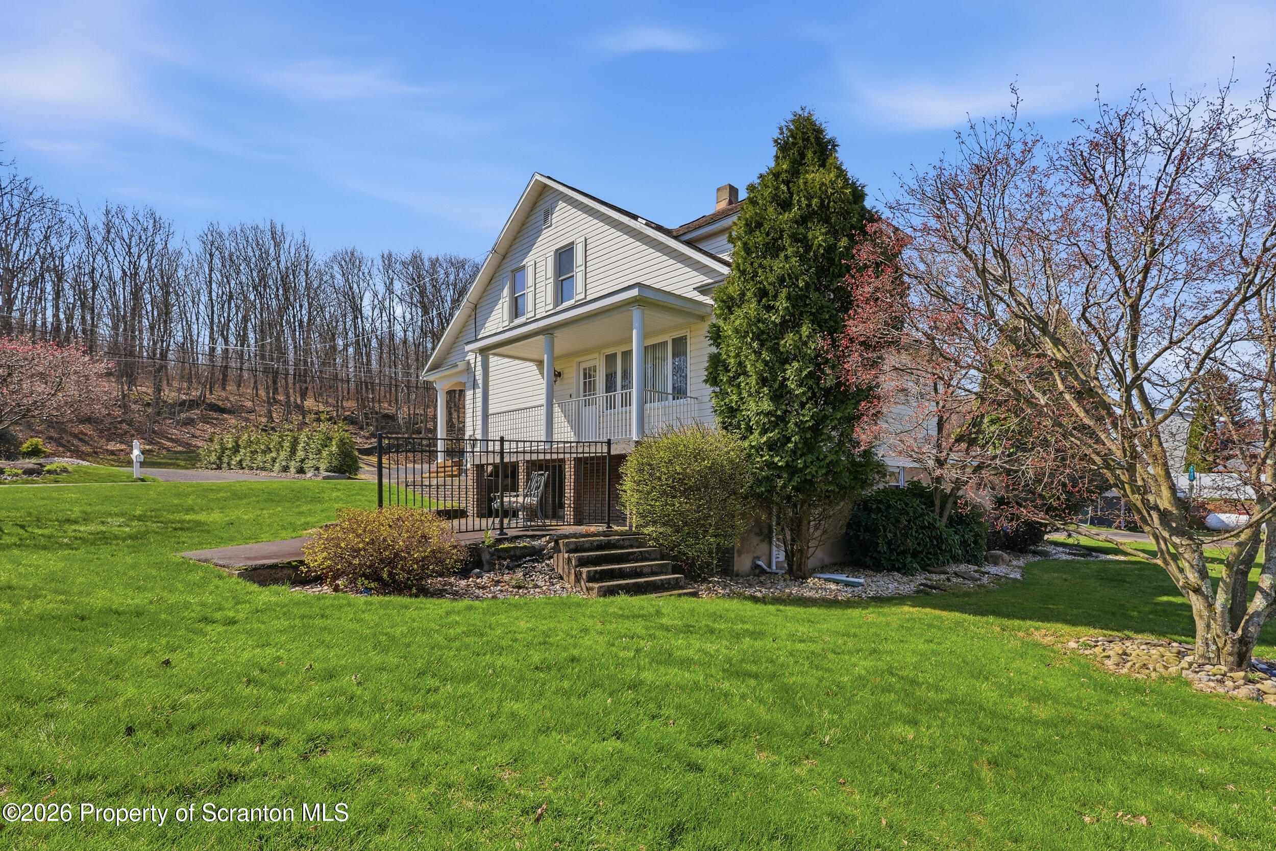 143 Old Boston Road Pittston, PA 18640 - Photo 4 of 61 a front view of a house with garden