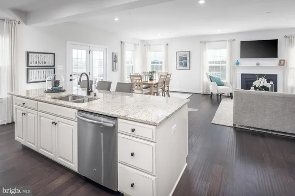 a open kitchen with sink cabinets and wooden floor