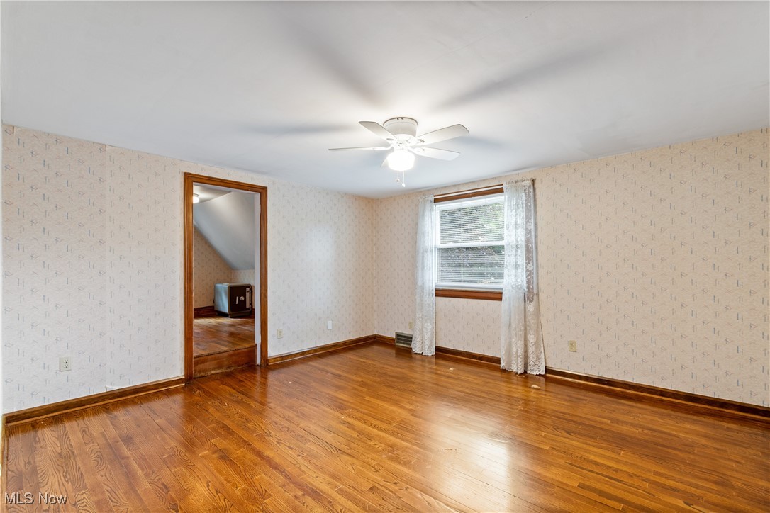 3550 Manchester Road Akron, OH 44319 - Photo 18 of 40 Spare room with ceiling fan and hardwood / wood-style flooring
