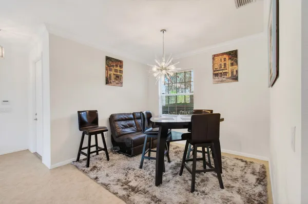 a kitchen with granite countertop stainless steel appliances a stove sink microwave and cabinets