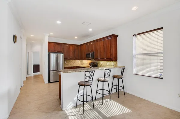 a view of hallway with wooden floor