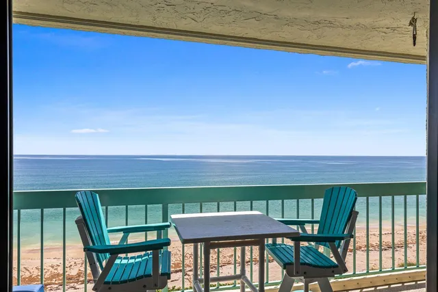 a view of a dining room with furniture and window
