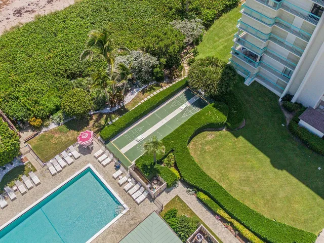 swimming pool with outdoor seating and trees